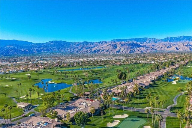 aerial view featuring a water and mountain view