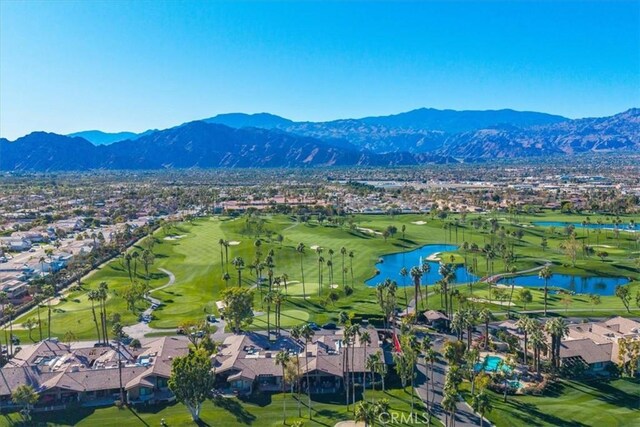 drone / aerial view with a water and mountain view