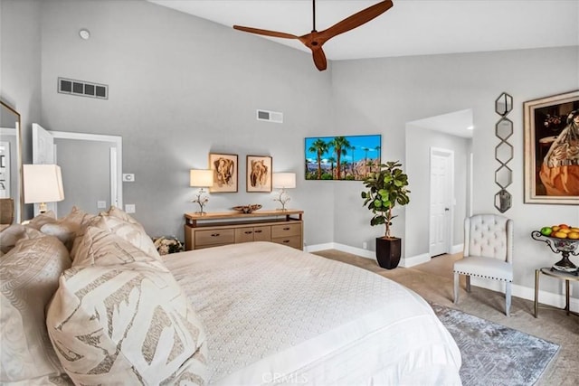 carpeted bedroom featuring high vaulted ceiling and ceiling fan