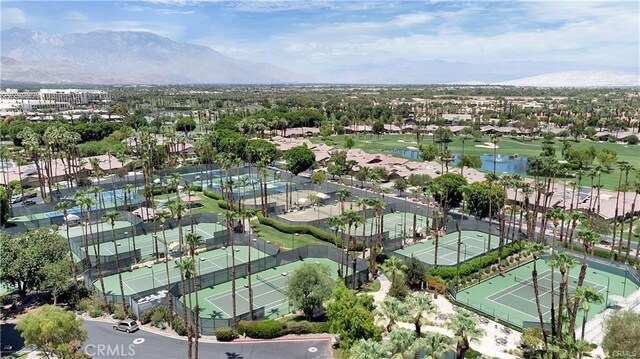 birds eye view of property with a mountain view