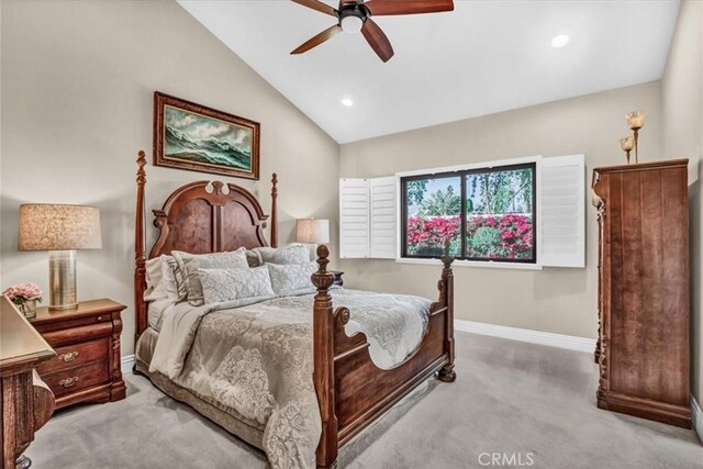 carpeted bedroom featuring ceiling fan and vaulted ceiling