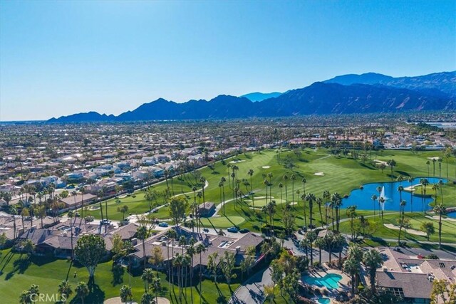 drone / aerial view with a water and mountain view