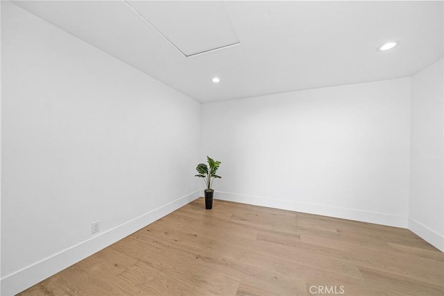 unfurnished room with light hardwood / wood-style floors