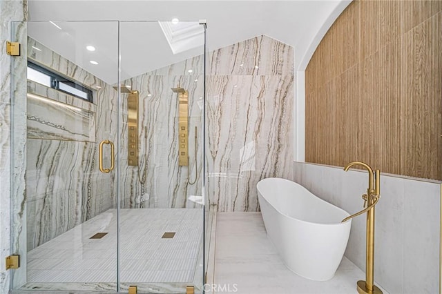 bathroom featuring separate shower and tub