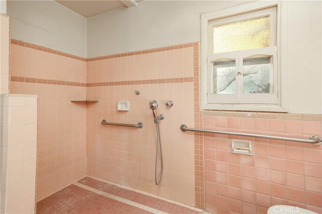 full bathroom with tiled shower