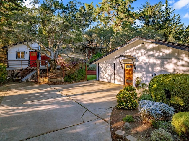 exterior space with an outdoor structure and a garage