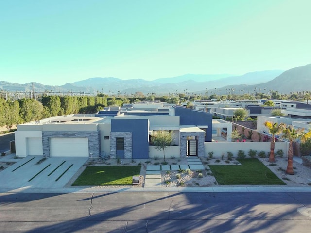 view of front of home featuring a garage and a mountain view