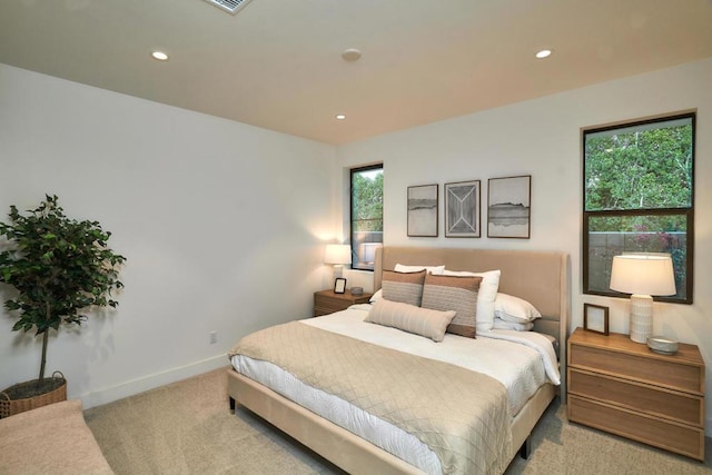 bedroom with light colored carpet