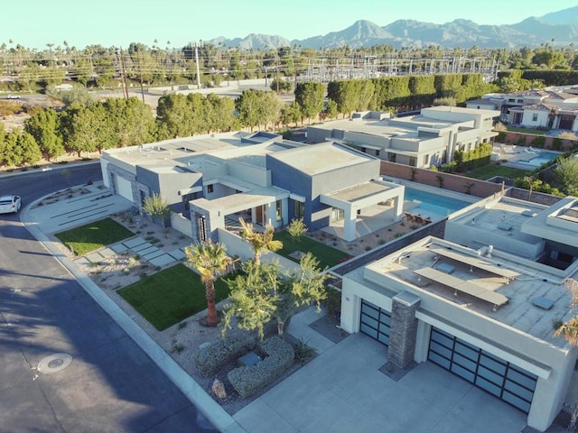 birds eye view of property featuring a mountain view