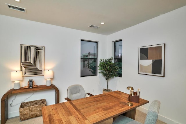 dining room with light carpet