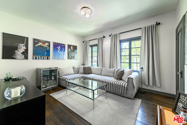 living room featuring dark wood-type flooring and wine cooler