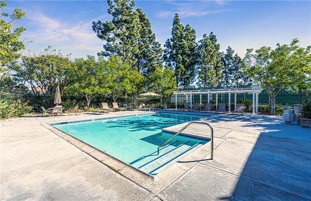 view of swimming pool featuring a patio area