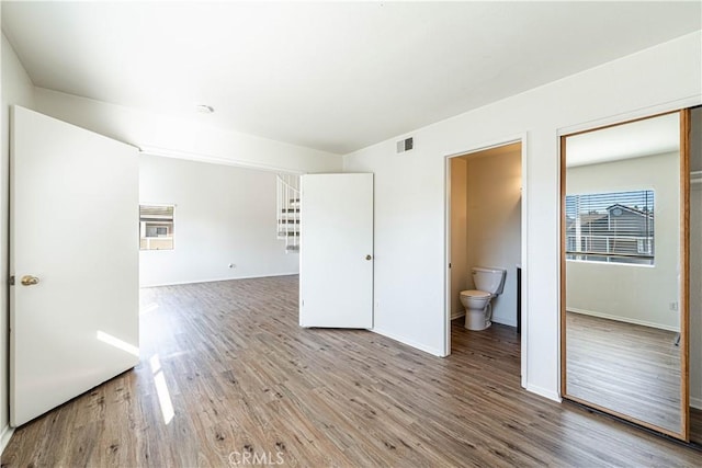 empty room with wood-type flooring