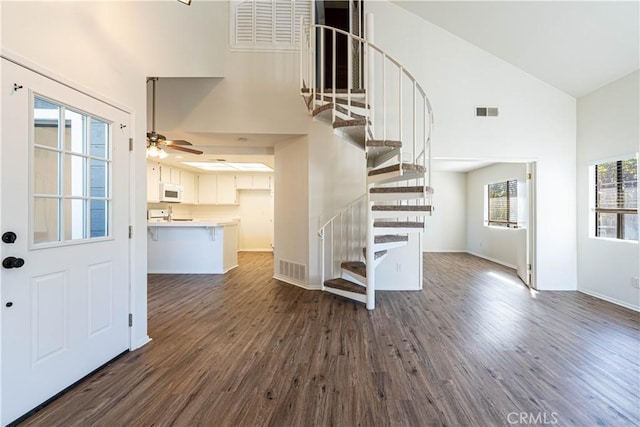 interior space featuring high vaulted ceiling, ceiling fan, and hardwood / wood-style floors