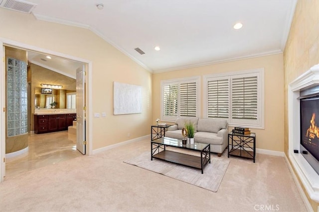 living area featuring light carpet, visible vents, lofted ceiling, and ornamental molding