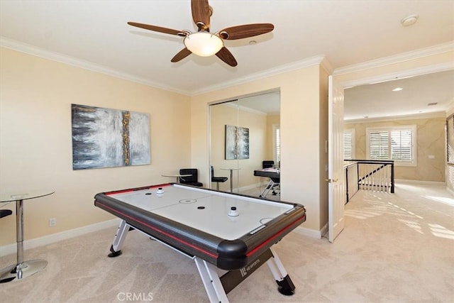 recreation room with baseboards, light carpet, and ornamental molding