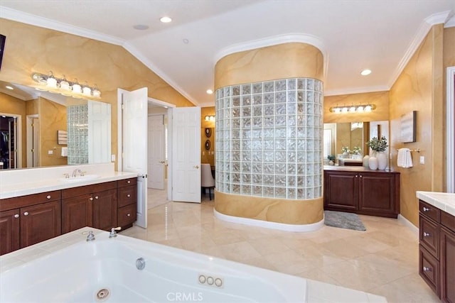 bathroom with two vanities, ornamental molding, a sink, lofted ceiling, and a whirlpool tub