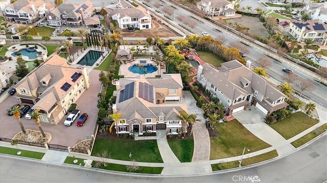 birds eye view of property with a residential view