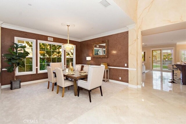 dining room with visible vents, baseboards, a chandelier, and crown molding