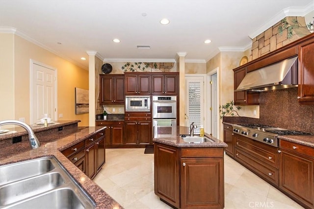 kitchen with under cabinet range hood, visible vents, stainless steel appliances, and a sink