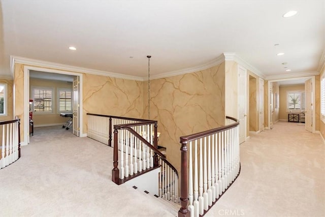 corridor featuring an upstairs landing, recessed lighting, light colored carpet, and crown molding