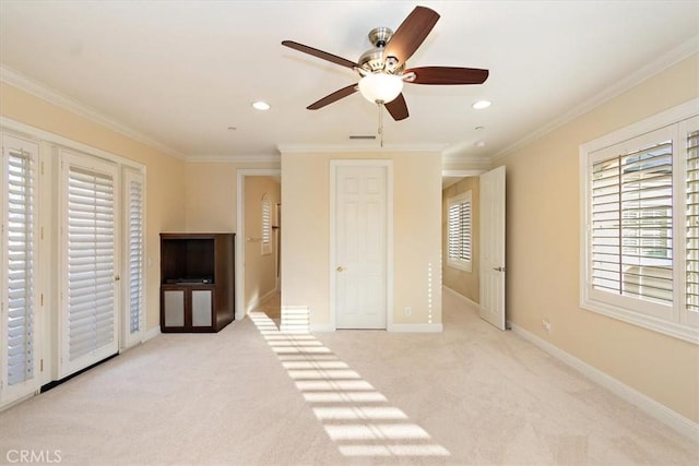 unfurnished bedroom featuring carpet flooring, recessed lighting, baseboards, and ornamental molding