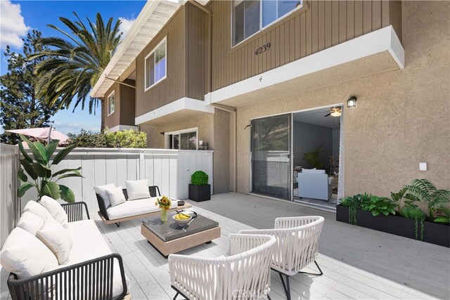 wooden deck featuring outdoor lounge area