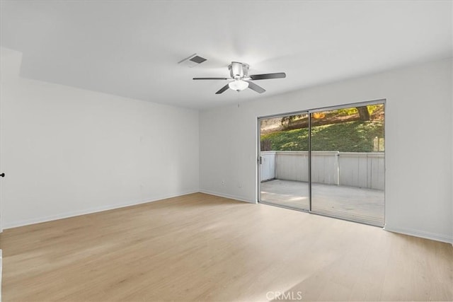 unfurnished room with light hardwood / wood-style flooring and ceiling fan