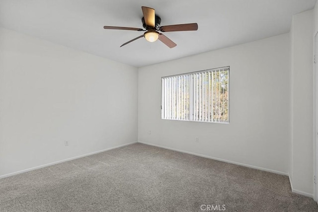 unfurnished room featuring carpet flooring and ceiling fan