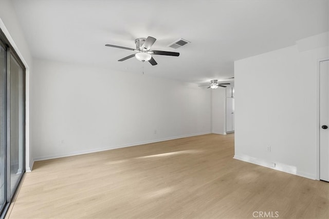 spare room with light hardwood / wood-style floors and ceiling fan