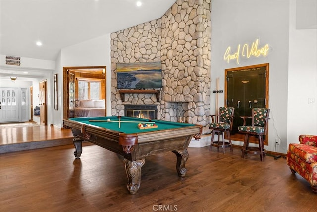 recreation room with pool table, lofted ceiling, a fireplace, and wood-type flooring