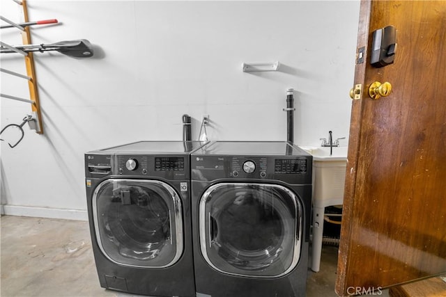 laundry room with washing machine and dryer