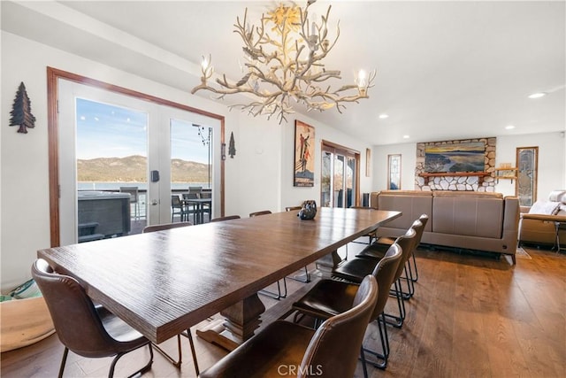 dining room featuring a chandelier, a mountain view, and hardwood / wood-style floors