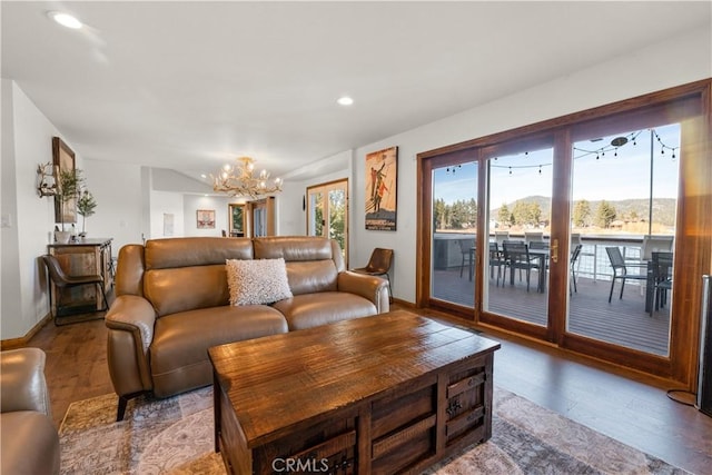 living room featuring an inviting chandelier and wood-type flooring