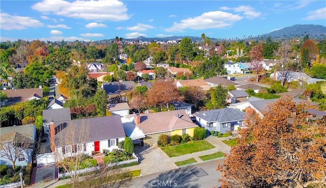 birds eye view of property with a mountain view