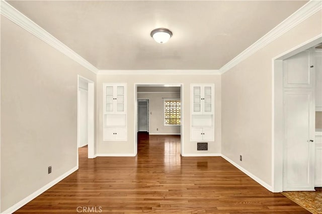 unfurnished room with hardwood / wood-style flooring and crown molding