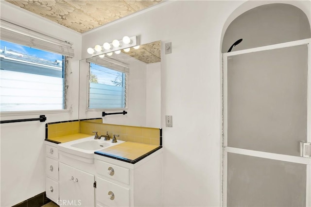 bathroom featuring backsplash and vanity