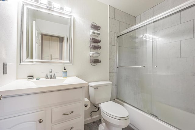 full bathroom featuring wood-type flooring, enclosed tub / shower combo, vanity, and toilet