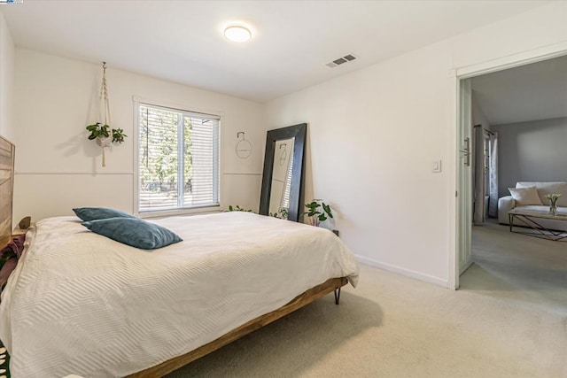 bedroom with light carpet