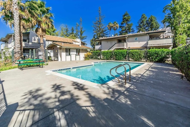 view of pool featuring a patio area