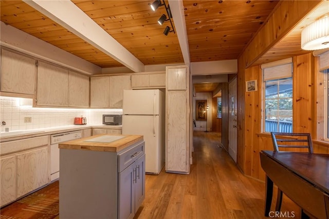 kitchen featuring beamed ceiling, white appliances, light hardwood / wood-style flooring, a kitchen island, and wood ceiling