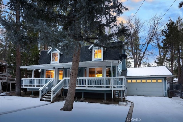 view of front of home featuring a garage and covered porch