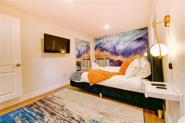 bedroom with hardwood / wood-style flooring