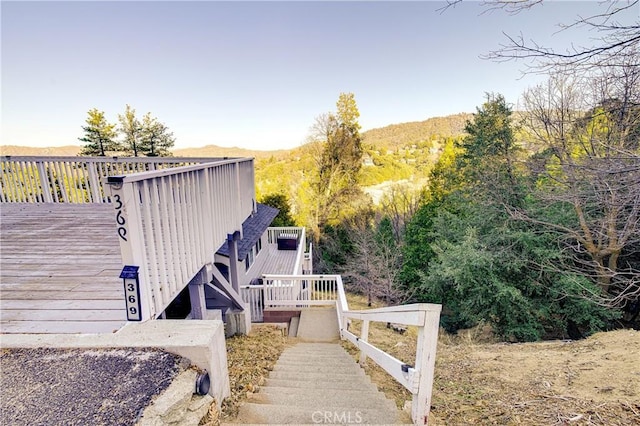 view of side of property with a wooden deck