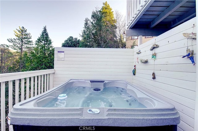 deck with a hot tub