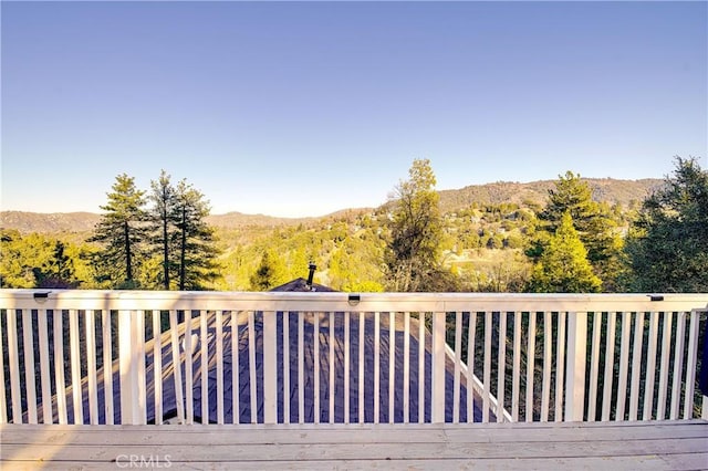 wooden terrace featuring a mountain view