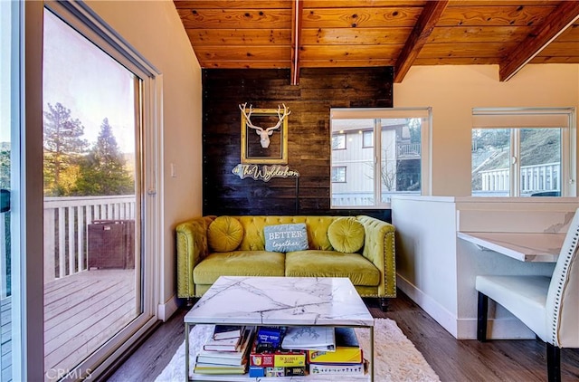 sitting room with wooden ceiling, dark hardwood / wood-style floors, and lofted ceiling with beams