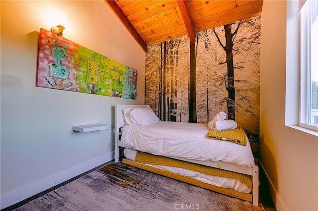 bedroom with vaulted ceiling with beams and wooden ceiling