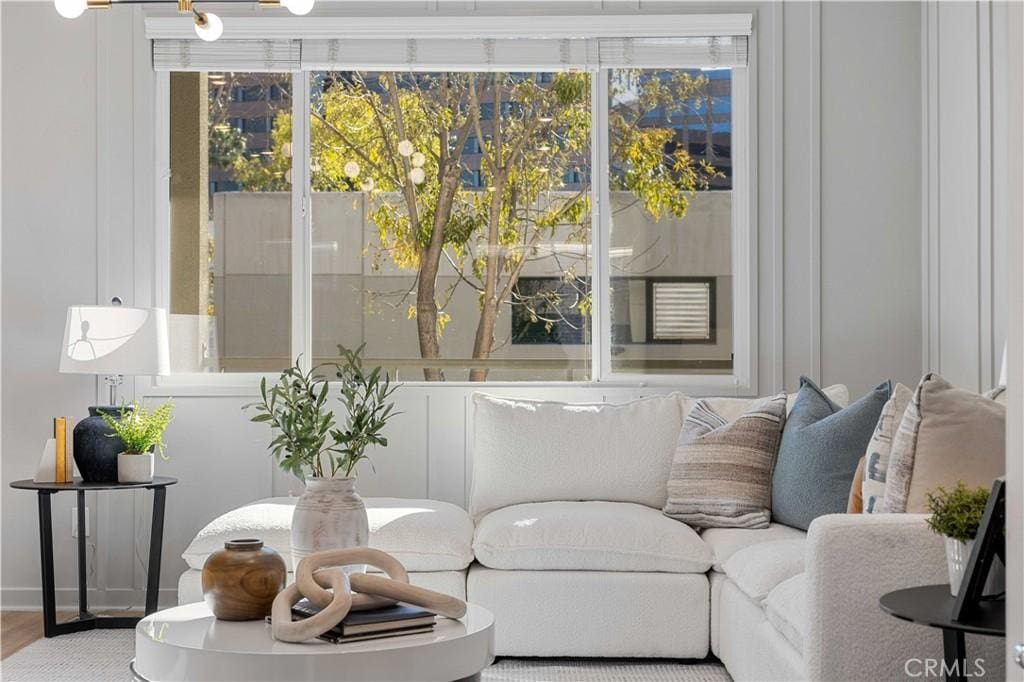 living area with hardwood / wood-style floors