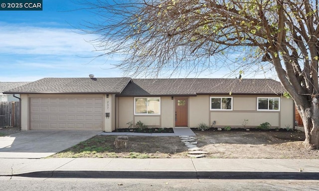 ranch-style home featuring a garage